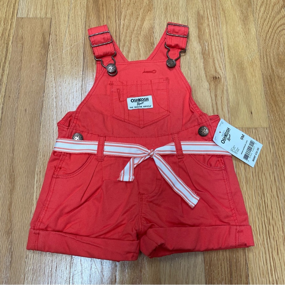 Oshkosh B’Gosh, red/orange color with belt detail shorts overalls size 6 months